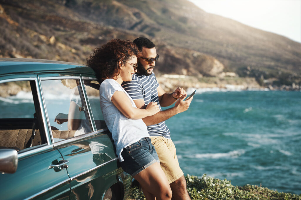 Couple reading tips on how to protect their finances while traveling