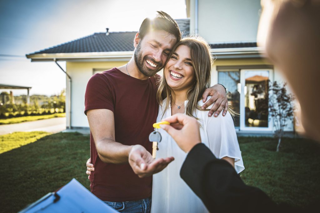 Happy couple who purchased a home can use the benefits of a HELOC for financial goals