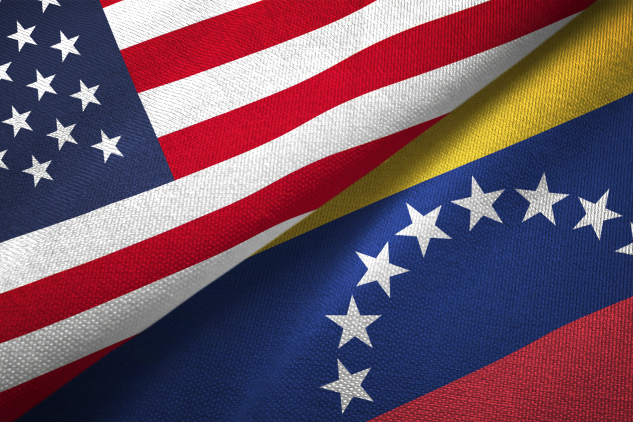 Venezuela debt recovery amid oil shock - us and venezuela flags displayed
