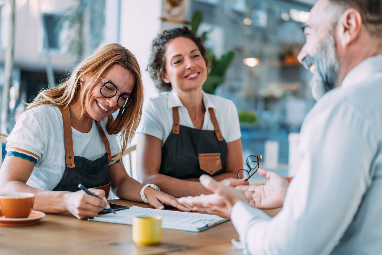 two business owners and a banker discuss tips for small businesses seeking financing in florida