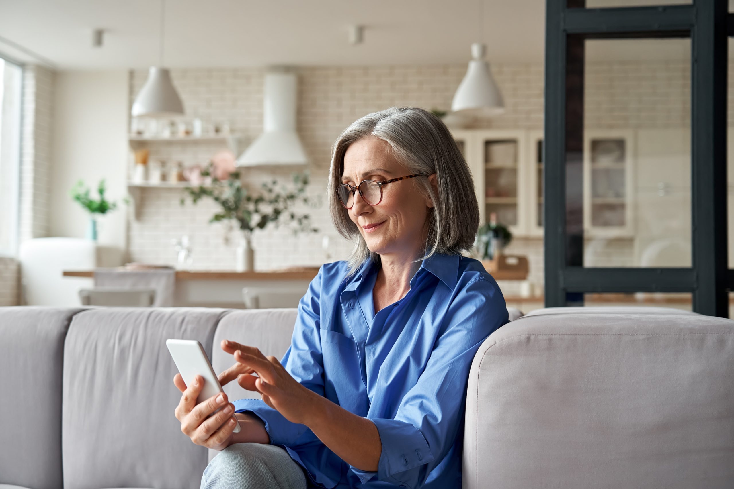older woman learning about scams targeting older adults and how to protect herself